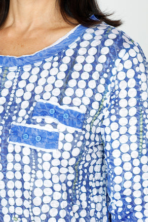 Top Ligne Dots Button Tab Top in Blue with streaming white dot pattern.  Crew neck 3/4 sleeve crinkle top.  White inset with raw edge at neck, cuff and hem.  2 tabs with button trim at left breast.  Relaxed fit._59670298263918