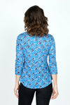 Top Ligne Rose Print V neck in Blue.  Blue on blue jacquard rose print overprinted in  a black diagonal geometric pattern.  V Neck, 3/4 sleeve crinkle top with curved hem. Relaxed fit._t_59570767659374