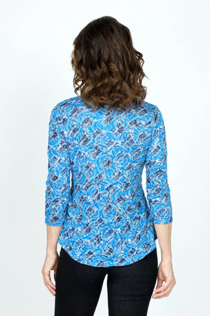 Top Ligne Rose Print V neck in Blue.  Blue on blue jacquard rose print overprinted in  a black diagonal geometric pattern.  V Neck, 3/4 sleeve crinkle top with curved hem. Relaxed fit._59570767659374