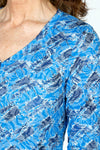 Top Ligne Rose Print V neck in Blue.  Blue on blue jacquard rose print overprinted in  a black diagonal geometric pattern.  V Neck, 3/4 sleeve crinkle top with curved hem. Relaxed fit._t_59570767757678