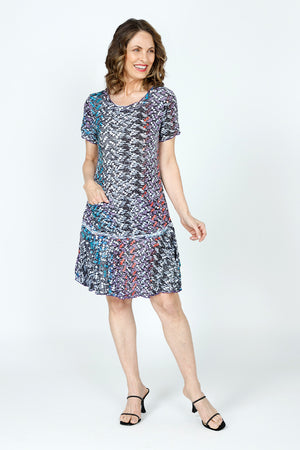 Top Ligne Cosmic Chips Dress in Multi.  Small geometric pattern.  Crew neck short sleeve crinkle dress.  Inset flounced tier at hip.  2 front patch pockets.  Side slits.  Relaxed fit._59570369724782