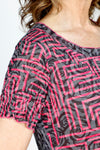 Top Ligne Geo Rose Dress.  Black & gray rose print with pink grid overlay.  Crew neck short sleeve dress with flounce inset from hip to hem.  2 front patch pockets.  Side slits.  Relaxed fit._t_59570387091822