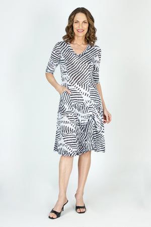 Top Ligne Mixed Stripes  Bubble Dress in Black/White.  V neck 3/4 sleeve crinkle dress with banded neckline.  Contour panels with multi-direction stripes.  2 front patch pockets.  Inner ties all around can be used as you want to create an asymmetric flounce hemline or a bubble shape.  Relaxed fit._59699172835694