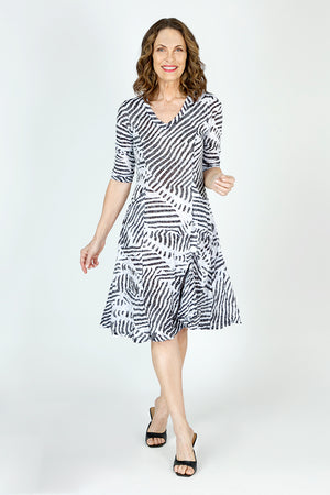 Top Ligne Mixed Stripes  Bubble Dress in Black/White.  V neck 3/4 sleeve crinkle dress with banded neckline.  Contour panels with multi-direction stripes.  2 front patch pockets.  Inner ties all around can be used as you want to create an asymmetric flounce hemline or a bubble shape.  Relaxed fit._59699172573550