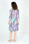 Top Ligne Color Streaks Bubble Dress in Multi.  Bright vertical streaks of color.  Banded v neck with 3/4 sleeve.  Contour seams.  2 front pouch pockets.  Inner ties can be adjusted to create an asymmetrical hemline or flounced tiered hem.  Relaxed fit._t_59699303383406