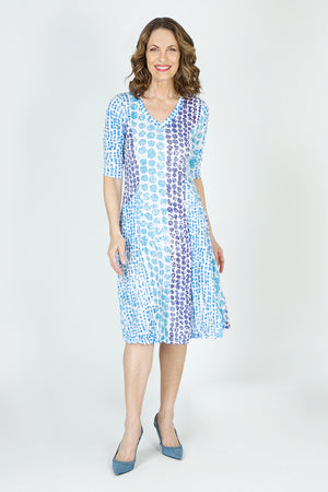 Top Ligne Dots Bubble Dress in Blue/White.  Vertical dot pattern in shades of blue on a white background.  Crinkle fabric v neck dress with 3/4 sleeve.  Contour seaming.  In seam front pockets.  Inner ties to change hem lengths; can be asymmetric or flounced as much as you want.  Relaxed fit._59699223724398