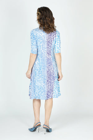 Top Ligne Dots Bubble Dress in Blue/White.  Vertical dot pattern in shades of blue on a white background.  Crinkle fabric v neck dress with 3/4 sleeve.  Contour seaming.  In seam front pockets.  Inner ties to change hem lengths; can be asymmetric or flounced as much as you want.  Relaxed fit._59699223789934