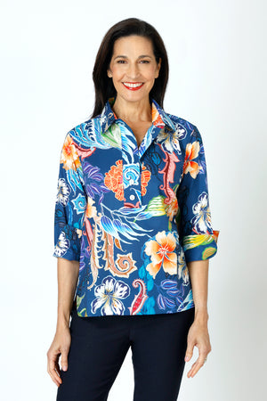 Hinson Wu Aileen Button Back Popover in Multi.  Bright tropical floral print on a medium blue background.  Pointed collar with 2 button placket.  3/4 sleeve with split turn back cuff. Back center buttons.  Relaxed fit._59647624085870