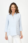 Beau Chemise Tulip Hem Blouse in Sky Blue. Pointed collar popover with 4 button placket. Tulip hem in front with 3 button trim on each side. 3/4 sleeve. Relaxed fit_t_59851083645294