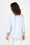 Beau Chemise Tulip Hem Blouse in Sky Blue. Pointed collar popover with 4 button placket. Tulip hem in front with 3 button trim on each side. 3/4 sleeve. Relaxed fit_t_59851083678062