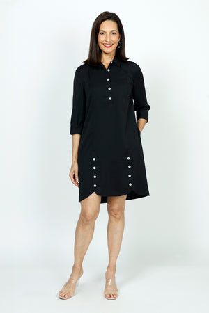 Beau Chemise Tulip Hem Dress in Black.  Popover dress with pointed collar and 5 button placket.  3/4 sleeve with split cuff.  Tulip hem in front with 4 button trim on each leg.  Relaxed fit._53000893956462