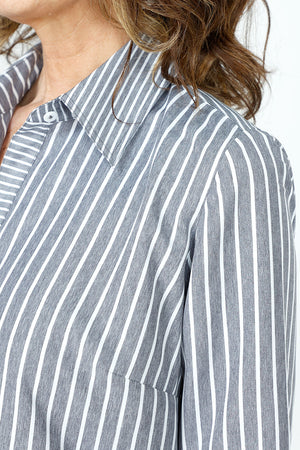 Cali Girls Jenna Stripe Dress in Black & White Stripes.  Pointed collar button down dress with 3/4 sleeves.  Asymmetric tiered ruffles in front.  Curved hem.  Relaxed fit._59563207917934