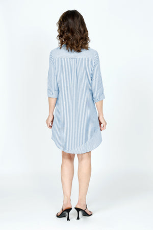 Cali Girls Jenna Stripe Dress in Periwinkle & White Stripes.  Pointed collar button down dress with 3/4 sleeves.  Asymmetric tiered ruffles in front.  Curved hem.  Relaxed fit._59563207852398