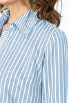 Cali Girls Jenna Stripe Dress in Periwinkle & White Stripes.  Pointed collar button down dress with 3/4 sleeves.  Asymmetric tiered ruffles in front.  Curved hem.  Relaxed fit._t_59563208049006