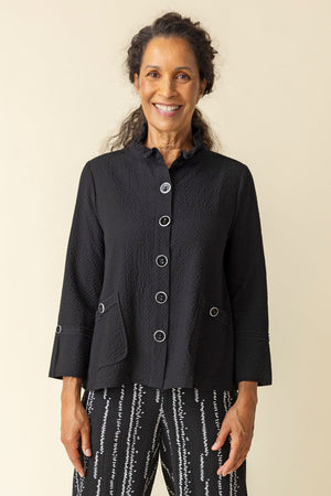 Habitat Crinkle Swing Jacket in Black.  Crinkle fabric.  Adjustable wire collar button down with novelty buttons.  2 front angled pockets with button detail. 3/4 sleeve with split cuff and single button detail.  Back yoke and inverted back pleat.  Relaxed fit._59770222739822