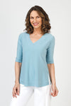 Sympli Splice V Neck Go To Top in Stone Blue.  Double layer v neck top.  Elbow length sleeve with double layer cuff.  Double layer at hem.  Raw edges.  A line shape.  Relaxed fit._t_59821469270382