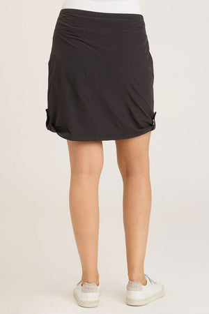 Wearables Jett Skort in Black.  Drawstring waist skirt with front pouch pockets and snap tab detail at side hem.  Attached short.  Skirt has 19" inseam: short: 3"_59448033280366