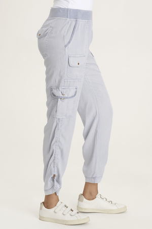 XCVI Sonova Pant in Spry Blue.  Pull on pant with terry elastic waist.  Front slash pockets.  Double cargo pockets with snap closures.  2 back snap flap pockets. Cinchable side seams with toggle closure.  Inseam: 28 1/2"._59594316743022