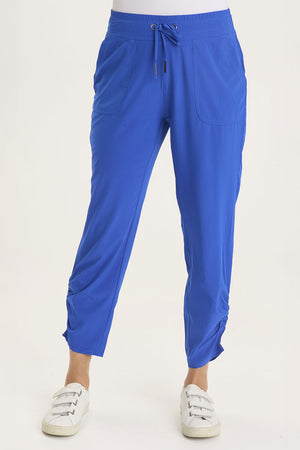 Wearables Active Lyan Pant in Cobalt.  Elastic drop waist pull on pant.  Ruched detail at lower leg.  2 front slash pockets.  27 1/2" inseam._59448073945454