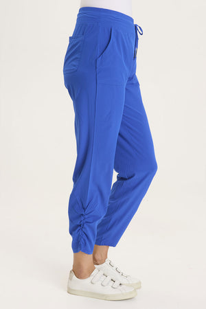 Wearables Active Lyan Pant in Cobalt.  Elastic drop waist pull on pant.  Ruched detail at lower leg.  2 front slash pockets.  27 1/2" inseam._59448062574958