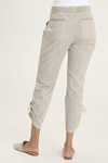 XCVI Otish Pant in Whitecap, a light beige.  Pull on pant with jersey waistband and poplin body.  2 front slash pockets with curved raw edge and grommet detail. 2 back patch pockets.  Front and back center seams.  Side cinch cord with toggle closure.  28" inseam._t_59594384736622