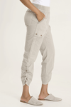 XCVI Otish Pant in Whitecap, a light beige.  Pull on pant with jersey waistband and poplin body.  2 front slash pockets with curved raw edge and grommet detail. 2 back patch pockets.  Front and back center seams.  Side cinch cord with toggle closure.  28" inseam._t_59594384834926