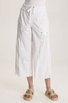 XCVI Seaver Gaucho in White.  Pull on pant with 1x1 rib waistband and drawstring.  2 deep front pockets with grommet trim and gathers.  2 rear patch pockets.  Wide leg, raw hem.  Inseam: 24 1/2"_t_59776995688814