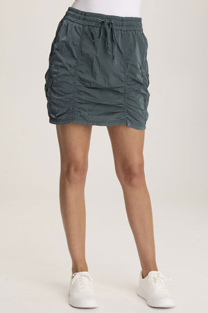 XCVI Marley Mini Skirt in Silken Pine.  Elastic drawstring waist mini skirt with contour seaming and ruched details.  Double cargo snap flap pockets.  A line shape.  Classic fit._59777140162926