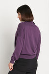 Planet Preppy Sweater in Plum. Pima cotton/modal soft knit. V neck with attached rib polo collar. Long sleeves. Drop shoulder. Rib trim at neck, hem and cuff. One size fits many. Relaxed fit._t_35944222523592