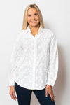 Sno Skins Embroidered Woven Blouse in White.  Pointed collar button down with floral tone on tone embroidery.  Long sleeves with button cuff and roll button tab.  Shirttail hem.  Relaxed fit._t_59765753807214