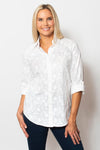 Sno Skins Embroidered Woven Blouse in White.  Pointed collar button down with floral tone on tone embroidery.  Long sleeves with button cuff and roll button tab.  Shirttail hem.  Relaxed fit._t_59765753905518