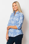 Sno Skins Embroidered Woven Blouse in Wedgewood blue.  Pointed collar button down with white floral  embroidery.  Long sleeves with button cuff and roll button tab.  Shirttail hem.  Relaxed fit._t_59765753839982