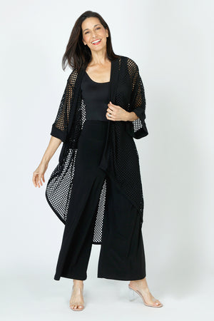 Sympli Honeycomb Kimono in Black.  Open weave high low topper.  Dolman elbow length sleeve.  Honeycomb open weave with solid jersey around neck and front placket and cuff.  
Relaxed fit._59726402814318