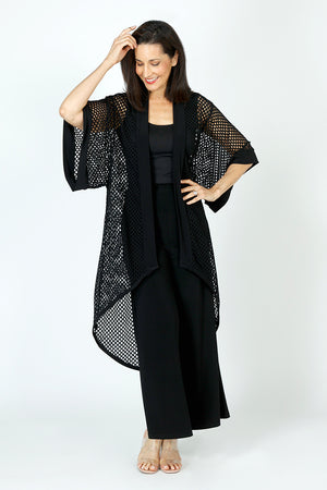 Sympli Honeycomb Kimono in Black.  Open weave high low topper.  Dolman elbow length sleeve.  Honeycomb open weave with solid jersey around neck and front placket and cuff.  
Relaxed fit._59726402879854