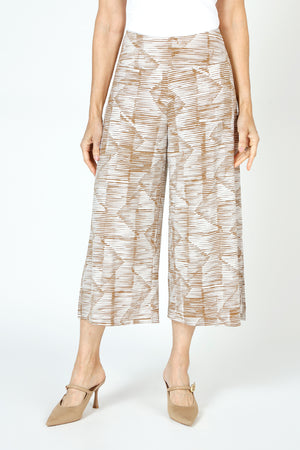 Sympli Side Slit Wide Leg Capri in Batista print.  Caramel and beige ikat print.  Elastic drop waist pull on crop pant.  Wide leg.  Deep slits on side.  Inseam: 23"_59652745691502