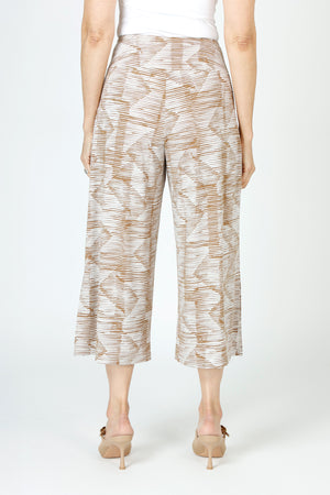 Sympli Side Slit Wide Leg Capri in Batista print.  Caramel and beige ikat print.  Elastic drop waist pull on crop pant.  Wide leg.  Deep slits on side.  Inseam: 23"_59652745658734