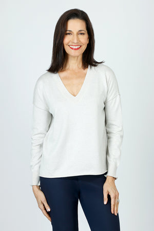 Lolo Luxe V Neck Sparkle Sweater in Sand.  Cotton and metallic thread combined for a subtle glow.  V neck long sleeve sweater.  Rib trim at neck and cuff.  Rolled hem.  Relaxed fit._59639339254126