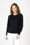 Lolo Luxe Grommet Sweater in Black.  Crew neck long sleeve sweater with metal grommet detail down center of each sleeve.  Rib trim at neck, hem and cuff.  Relaxed fit._t_59840767623534