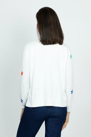 Lolo Luxe Multi Star Crew Sweater in White.  Multicolored intarsia knit stars on front and sleeves.  Plain back.  Long sleeves.  Rib trim at neck, hem and cuff.  Side slits.  Relaxed fit._59742193549678