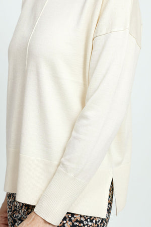 Metric Pull Over Seam Sweater in Cream. Crew neck long sleeve sweater with center raised seams.  Deep rib trim at hem and cuff.  Rolled neckline.  Relaxed fit._59513438142830