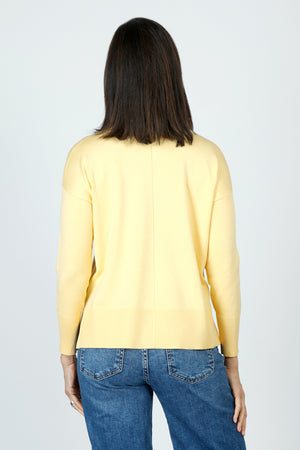 Metric Pull Over Seam Sweater in Pale Yellow.  Crew neck long sleeve sweater with center raised seams.  Deep rib trim at hem and cuff.  Rolled neckline.  Relaxed fit._59611327463790