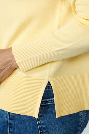 Metric Pull Over Seam Sweater in Pale Yellow.  Crew neck long sleeve sweater with center raised seams.  Deep rib trim at hem and cuff.  Rolled neckline.  Relaxed fit._59611327496558