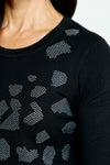 Metric Sequin Shapes Sweater in black.  Abstract shapes on front formed from rhinestone studs look like animal print.  Crew neck long sleeve sweater.  Rib trim at neck hem and cuff.  Rhinestone shape insignia at back neck.  Relaxed fit._t_52985411436910