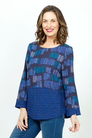 Habitat Travel Side Button Tunic in Sapphire.  Crew neck 3/4 sleeve top with 2 contrasting patterns.  Dropped waist.  Large block print on top with small scribble print on bottom front and back.  Split scribble print cuff.  Curved hem.  Novelty button detail on 1 side.  Relaxed fit._36322909323464