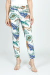 Holland Ave Tropical Leaves Ankle Pant.  Green, blue and orange large palm leaf print on an ivory background.  2 1/2" curved elastic waistband.  Snug through hip and thigh, slim through leg.  28" inseam._t_59575599366510