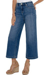 Liverpool Stride High Rise Crop Jean in Newcastle, a medium blue wash. 12" rise 5 pocket jean with button waist and zipper closure. Belt loops. Leg seam detail. 21" leg opening, 26" inseam._t_35791387820232