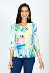 Top Ligne Watercolors V neck Top in Multi.  Bright abstract print on white.  V neck, with overlapping band.  3/4 sleeve.  Stamped, perforated fabric.  A line shape.  Relaxed fit._t_59584572522862