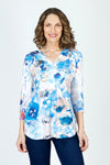 Top Ligne Flowers Button Back Tunic.  Blue and light brown watercolor floral print on white.  Slub textured knit v neck with faux 2 button placket.  3/4 sleeve. Back yoke with functional buttons down center back.  High low hem. Relaxed fit._t_59702553608558