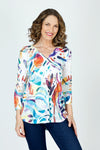 Top Ligne Flowers Button Back Tunic.  Bright watercolor abstract shapes screen printed on white.  Slub textured knit v neck with faux 2 button placket.  3/4 sleeve. Back yoke with functional buttons down center back.  High low hem. Relaxed fit._t_59702640869742