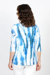 Top Ligne Floral Print Crinkle Tunic in Aqua. Blue aqua and lime abstract floral print. Crew neck crinkle with dolman elbow sleeve with ruffle cuff. Diagonal front seaming with asymmetrical insert at hem. Sewn edges. Relaxed fit._t_35571253608648